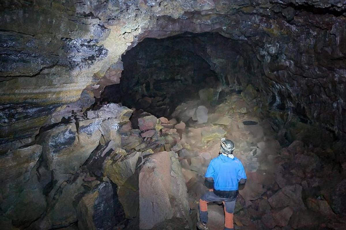 a man is standing in a cave