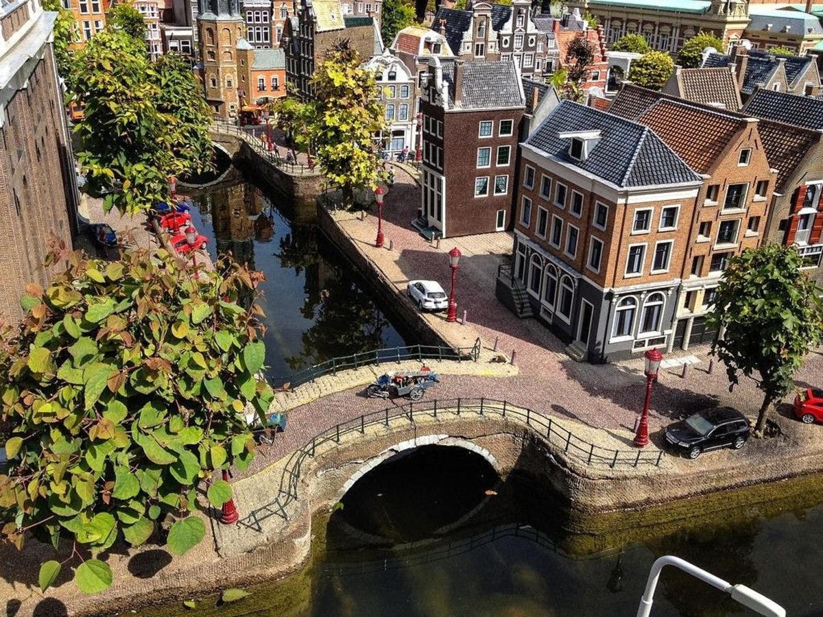 a bridge over a river in a city with buildings