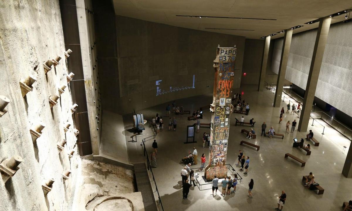 an overhead view of a crowd of people in a museum