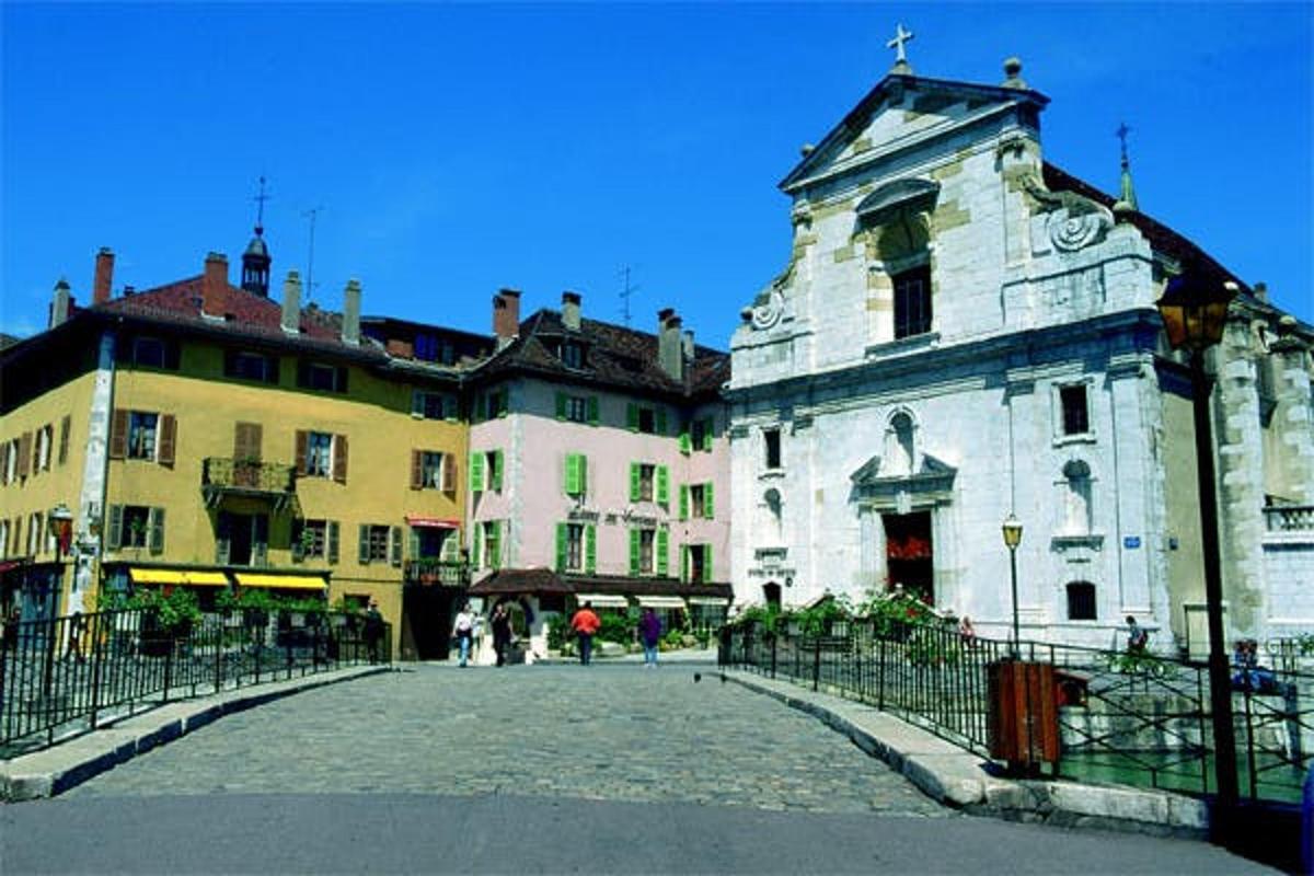 an old building with a fence in front of it