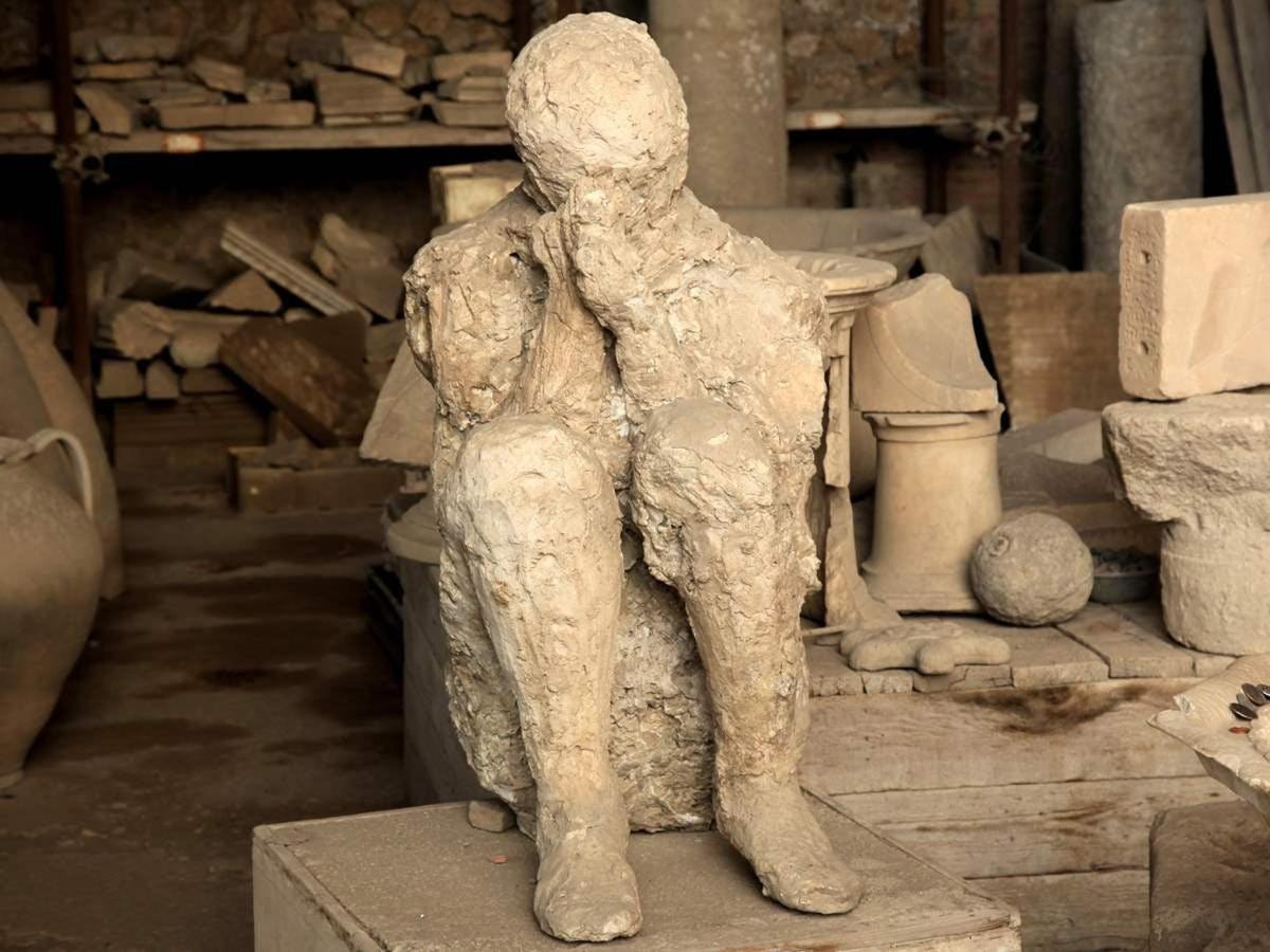 a statue of a man standing on a table
