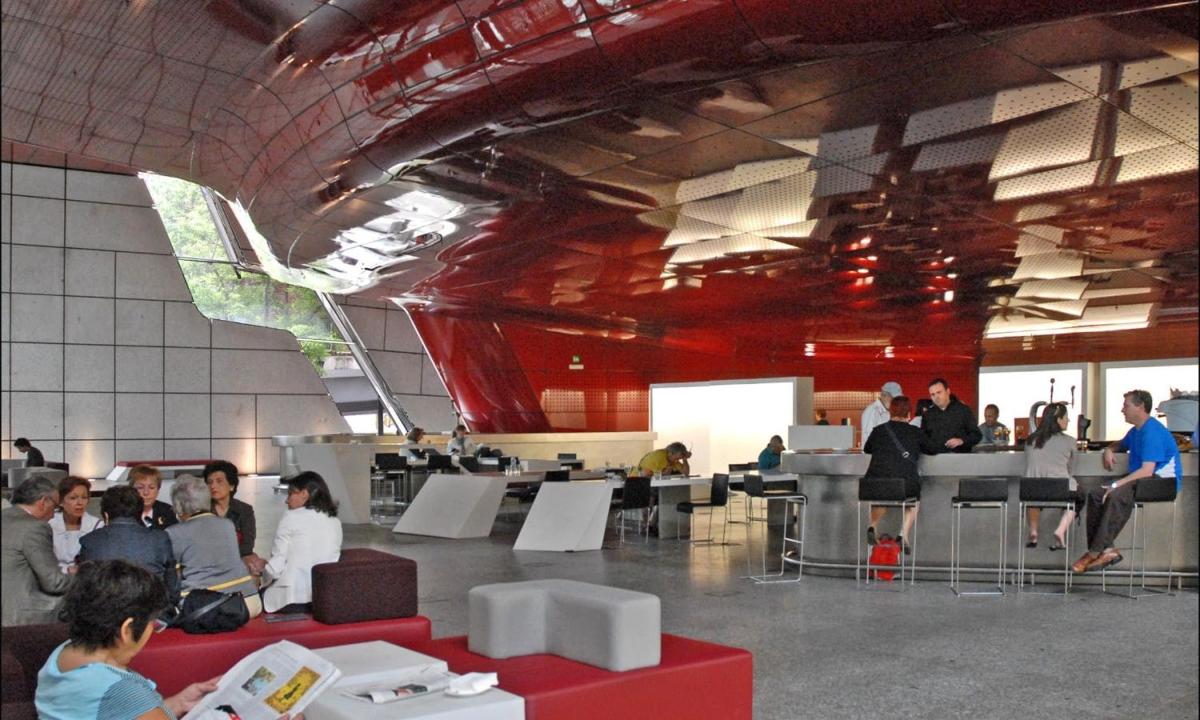 a group of people sitting in a large room