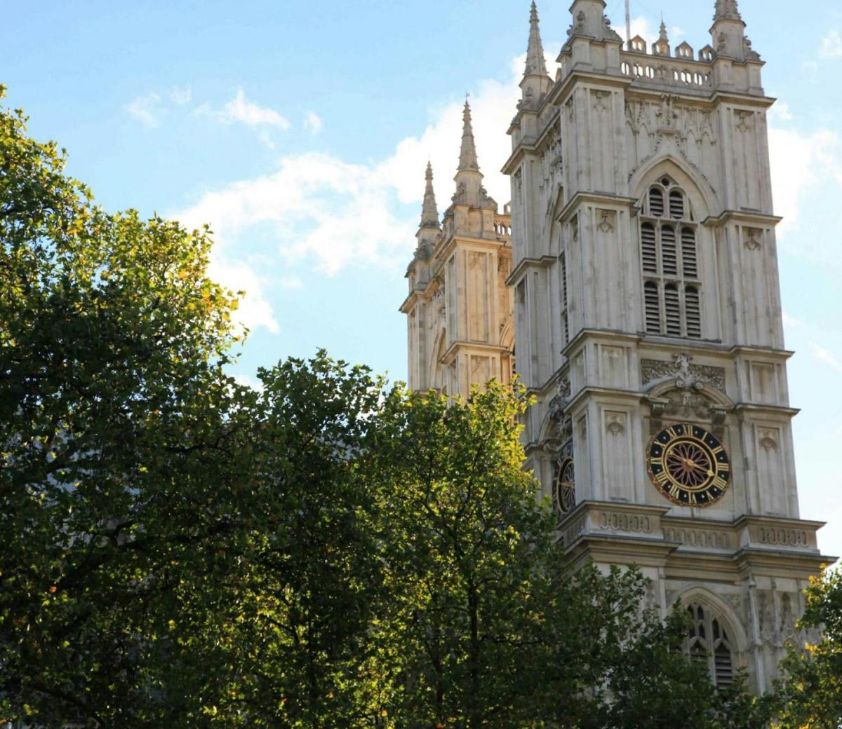 a tall tower with a clock on the side of it