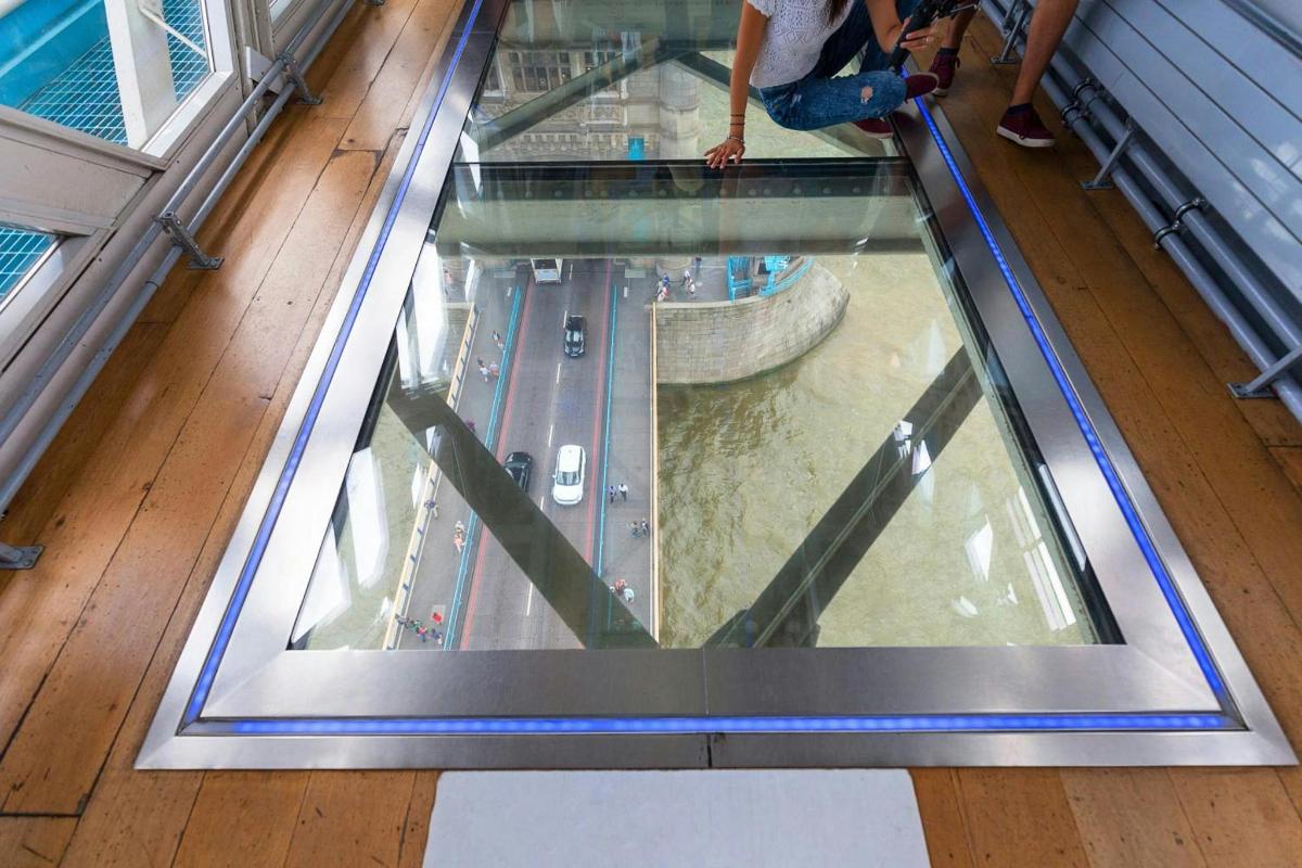 a glass floor in a building with a view of a river