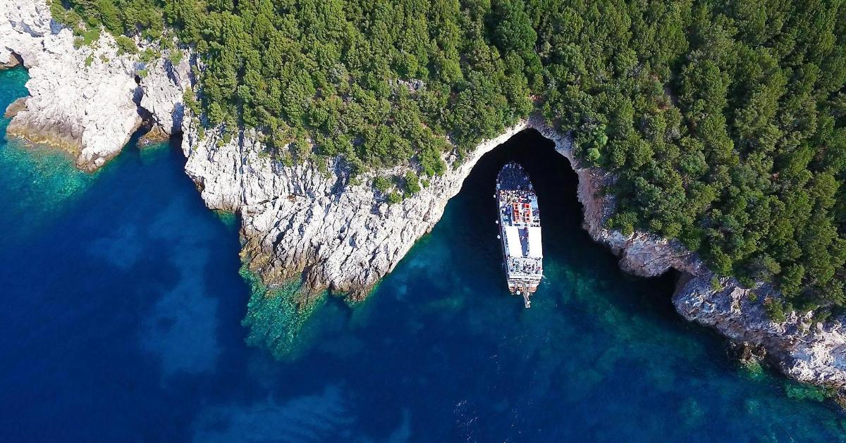 a boat in a cave in the middle of the water