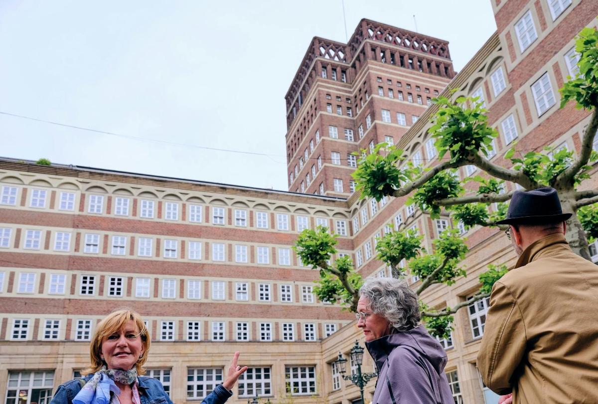 a group of people standing in front of a building