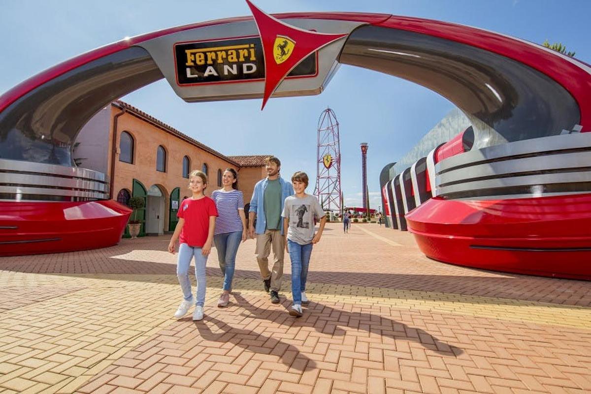 a rendering of a family standing under an arch at a theme park