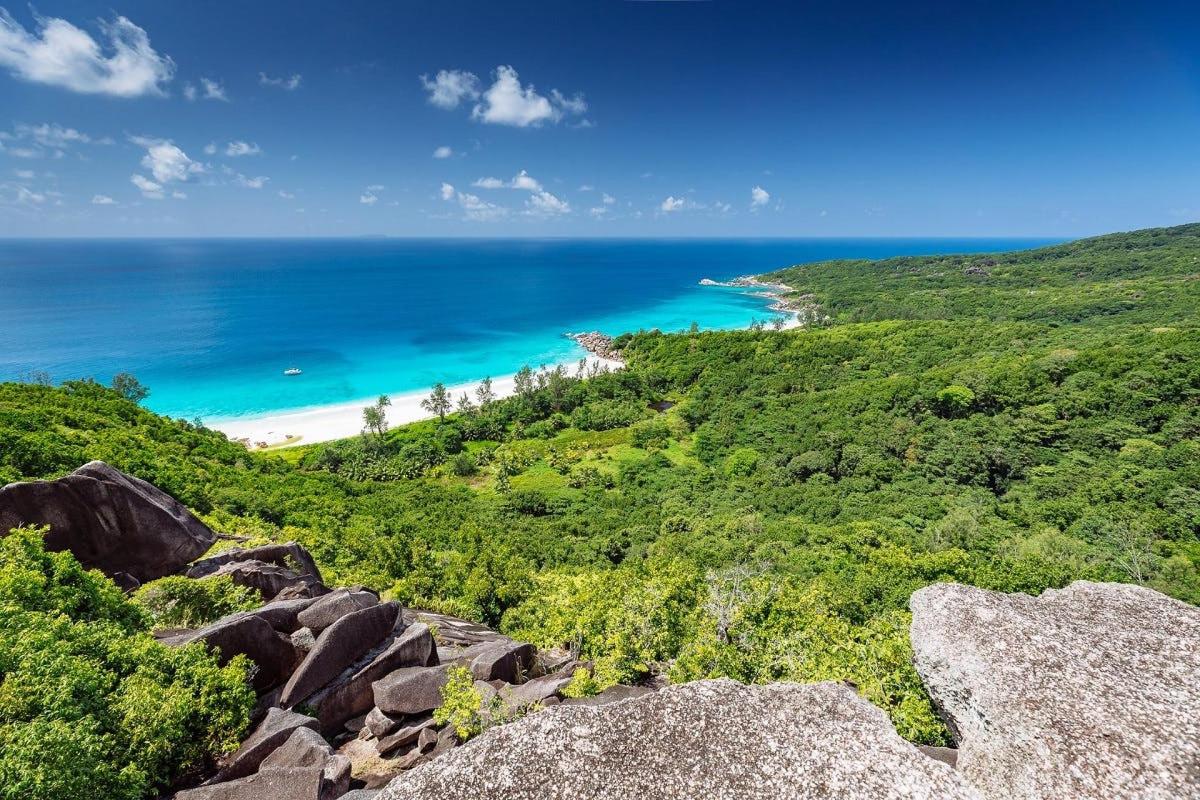 a view of the beach from the top of a mountain