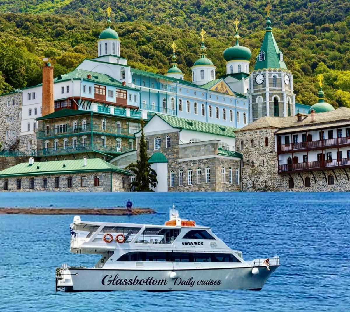 a boat in the water in front of a large building