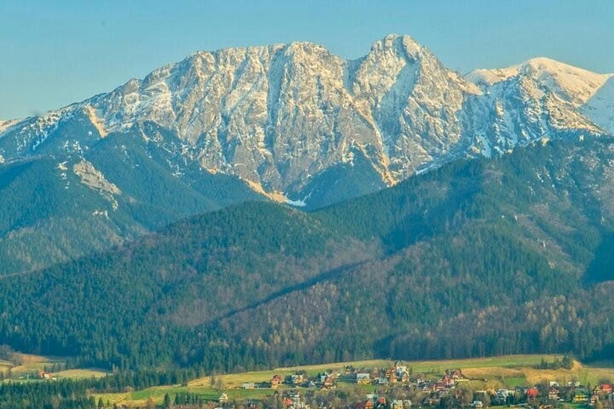 a mountain range with a town in front of it