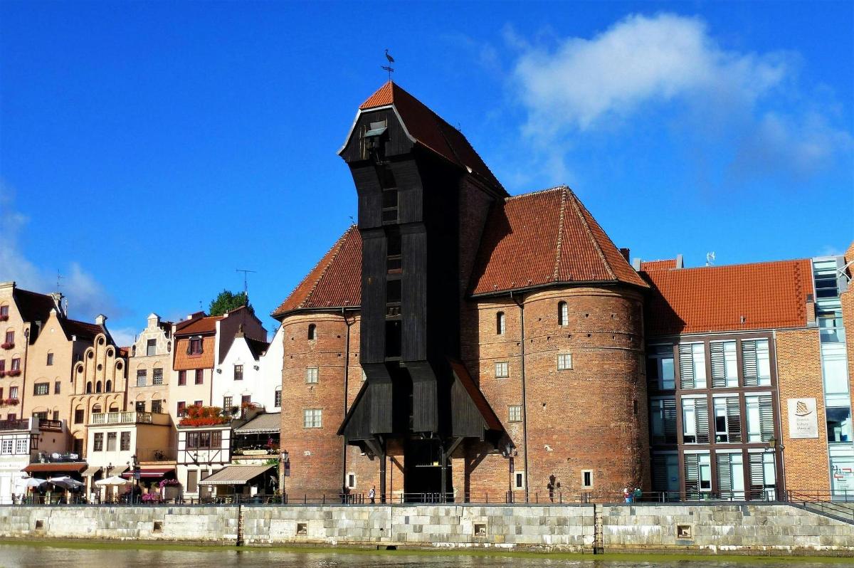a large red brick building with a clock tower