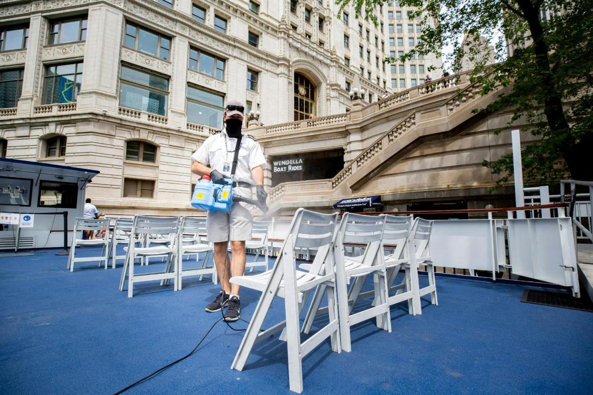 a man standing in front of a group of chairs