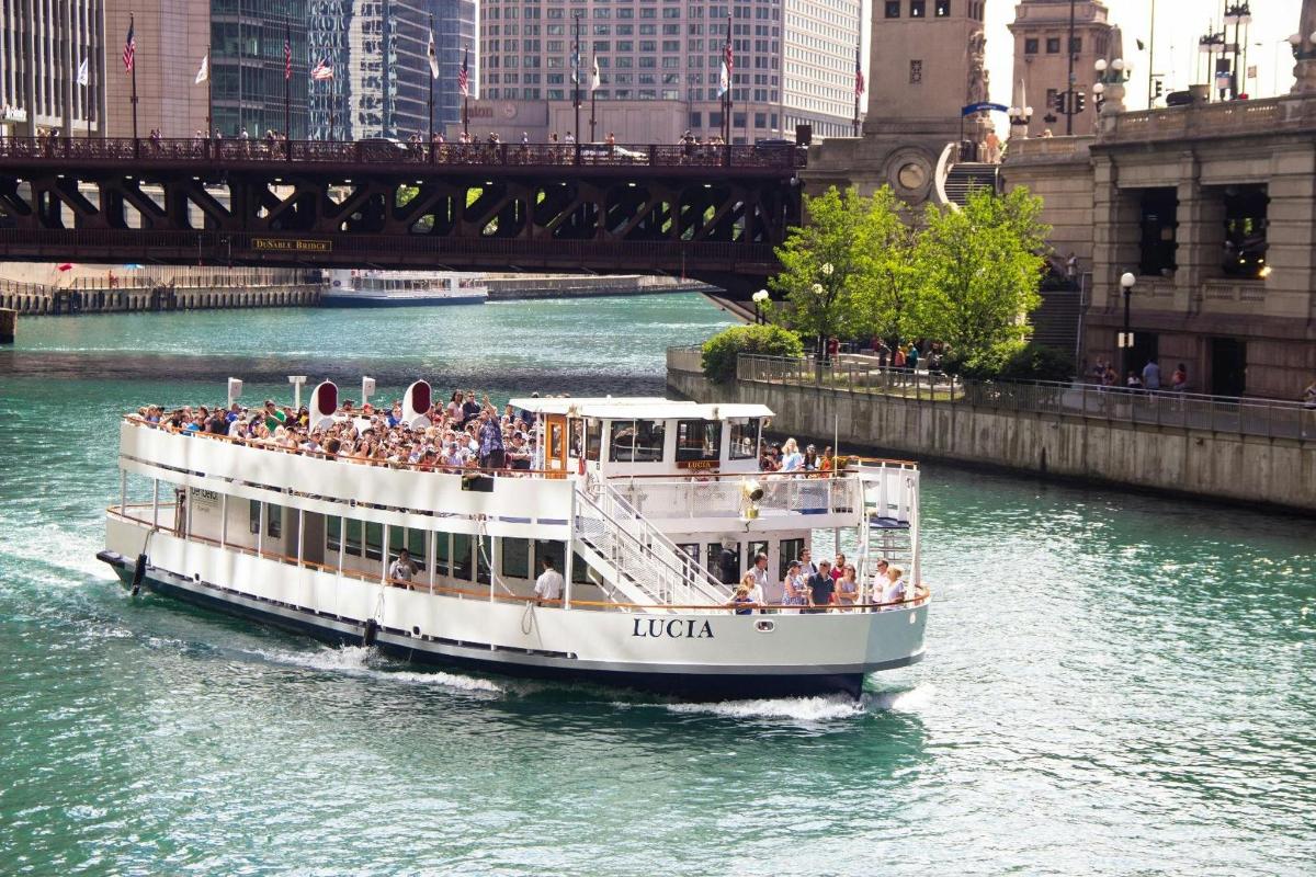 a boat with a lot of people on it on a river