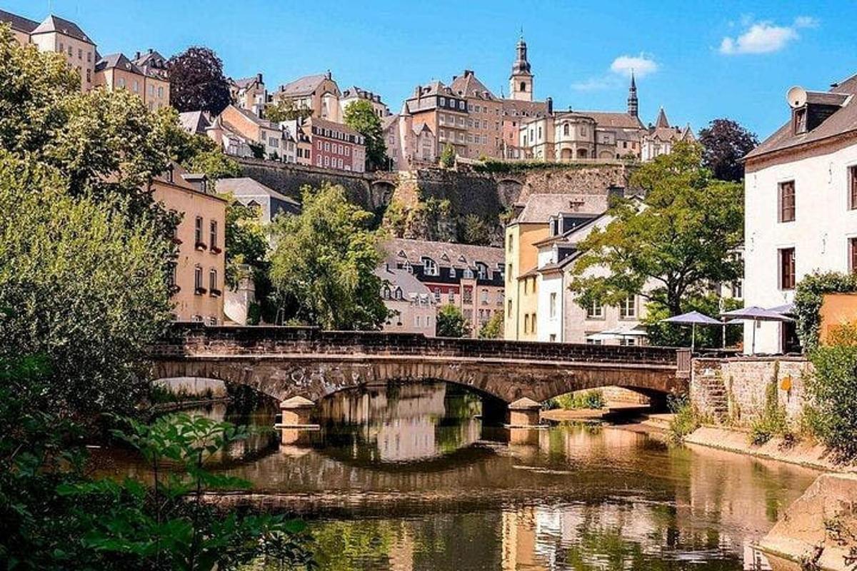 a bridge over a river in a city with buildings