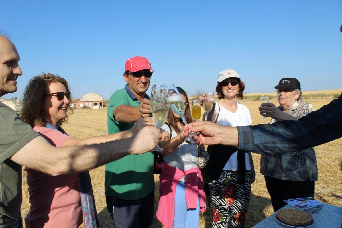 a group of people holding up glasses of champagne