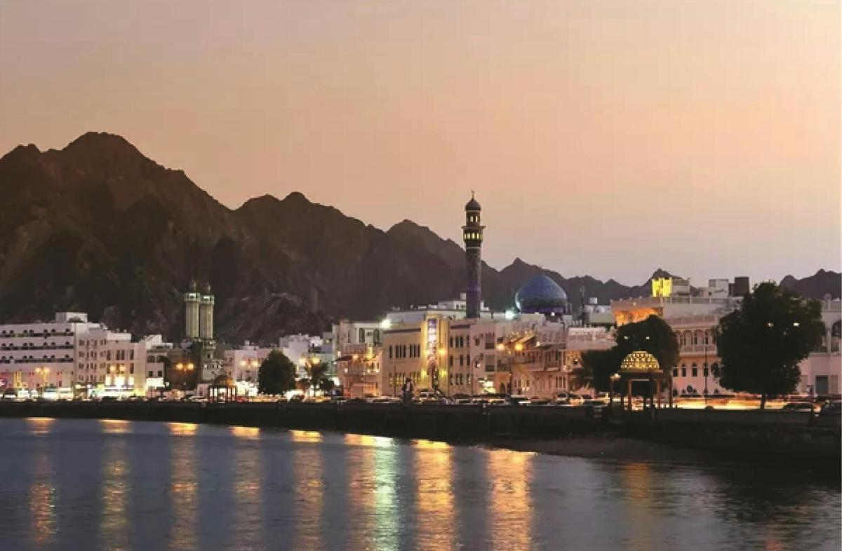 a city next to a body of water at night