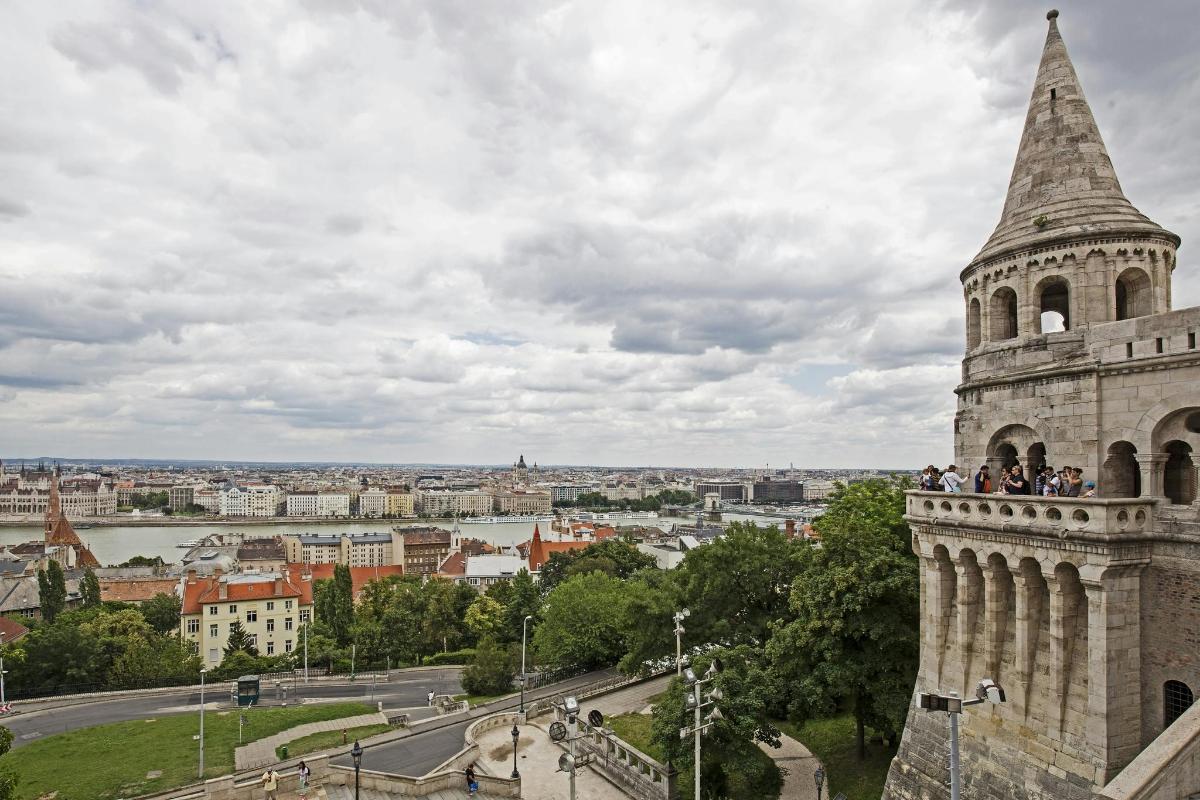 a group of people standing on top of a tower