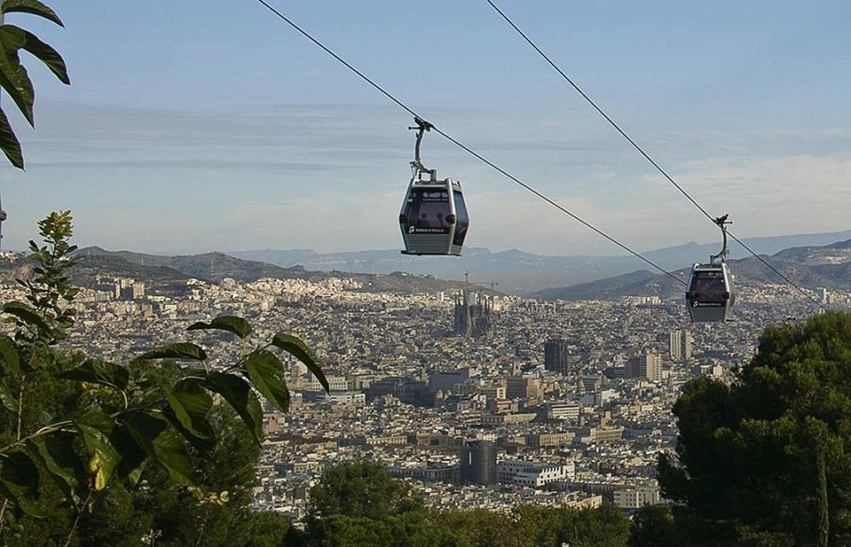 three cable cars flying over a city