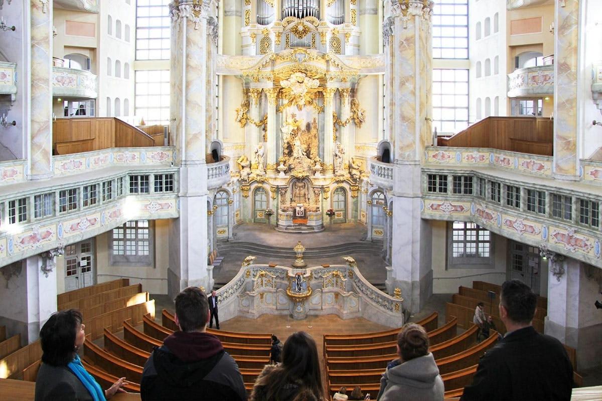 a group of people standing in a large building