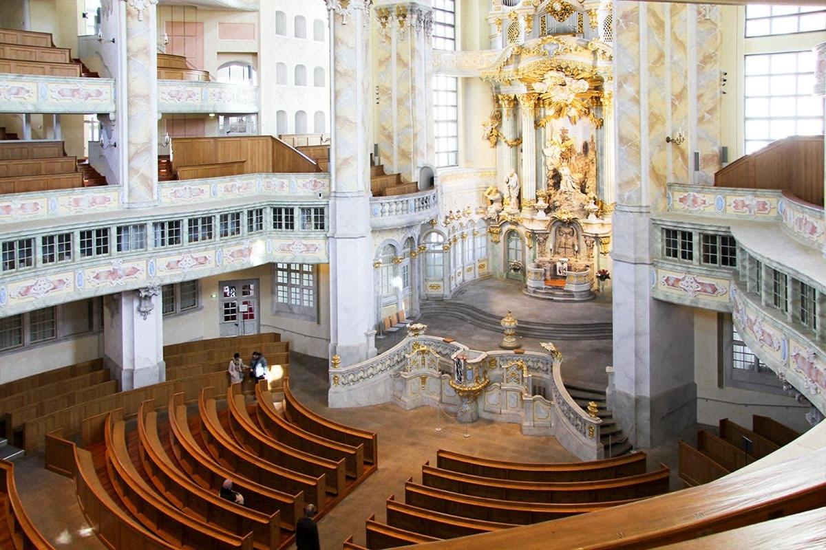 a view of a large building with stairs and chairs