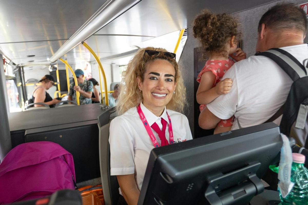 a woman is sitting on a bus