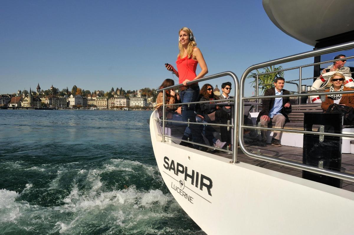 a group of people on a boat in the water