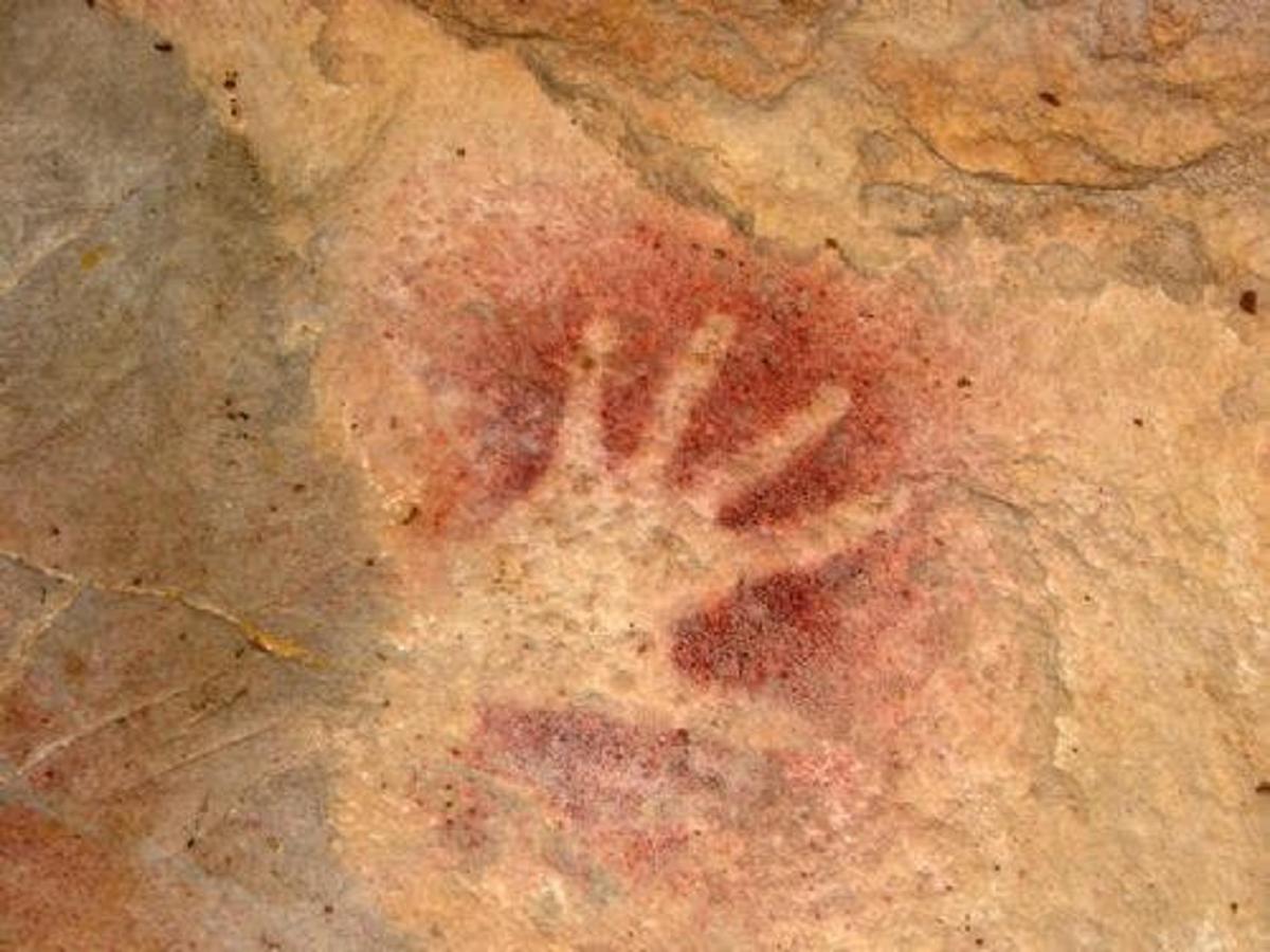 a handprint on top of a piece of bread