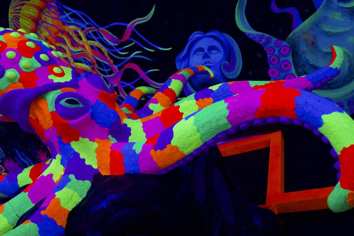 a colorful octopus in front of a woman