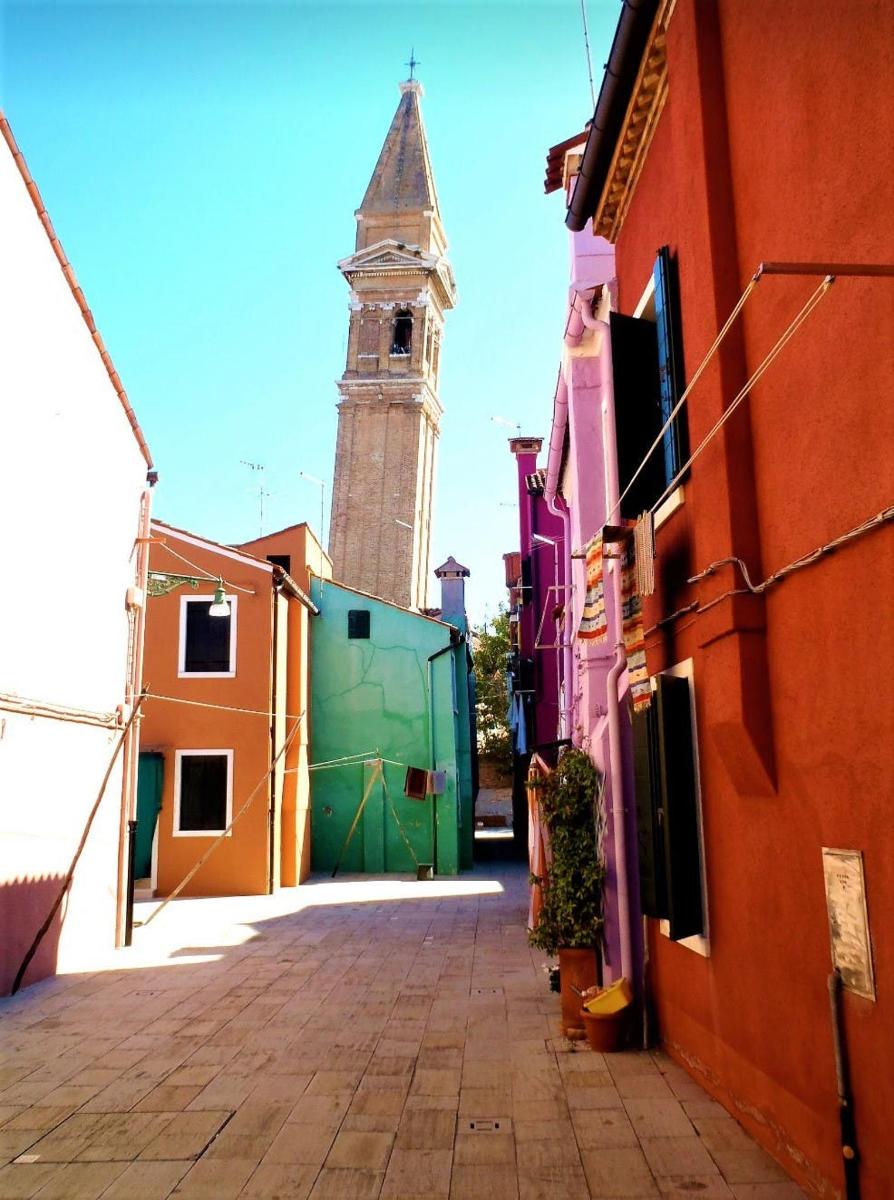 a street with a clock tower in the background