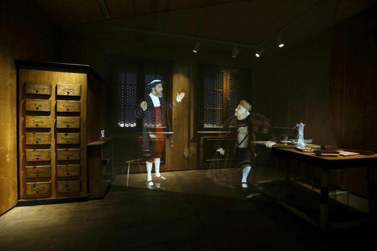 two mannequins are standing in a room with a window
