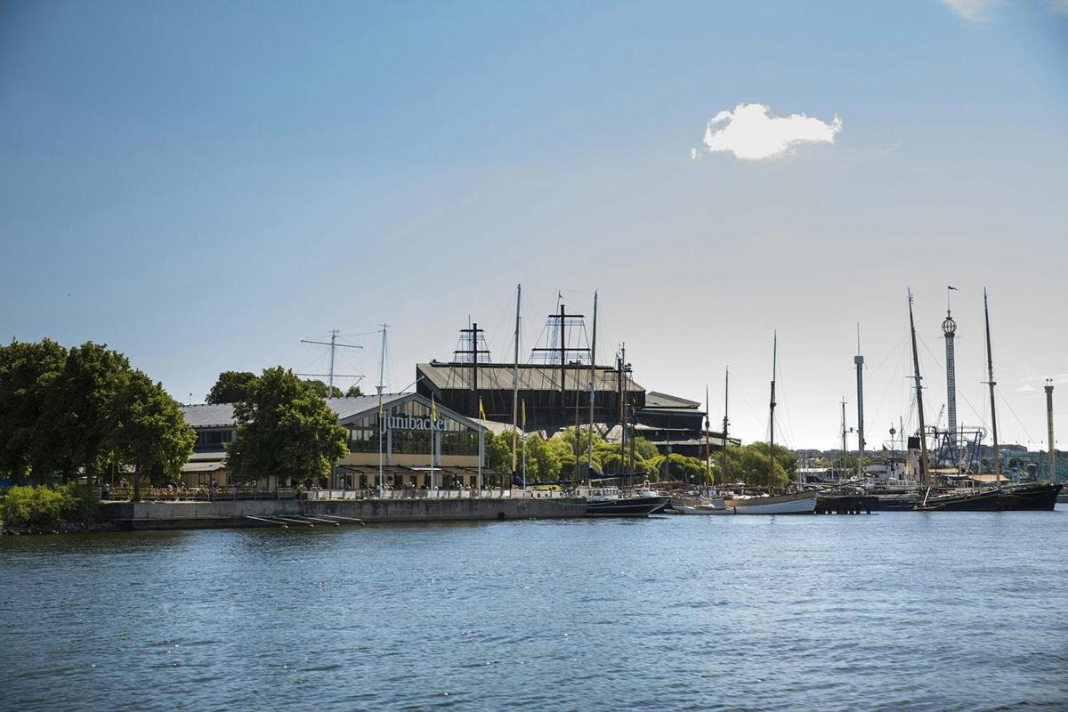 a view of a river with a building and a harbor