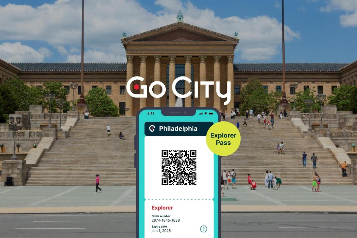 mobilní telefon s cedulí „Go City“ před budovou