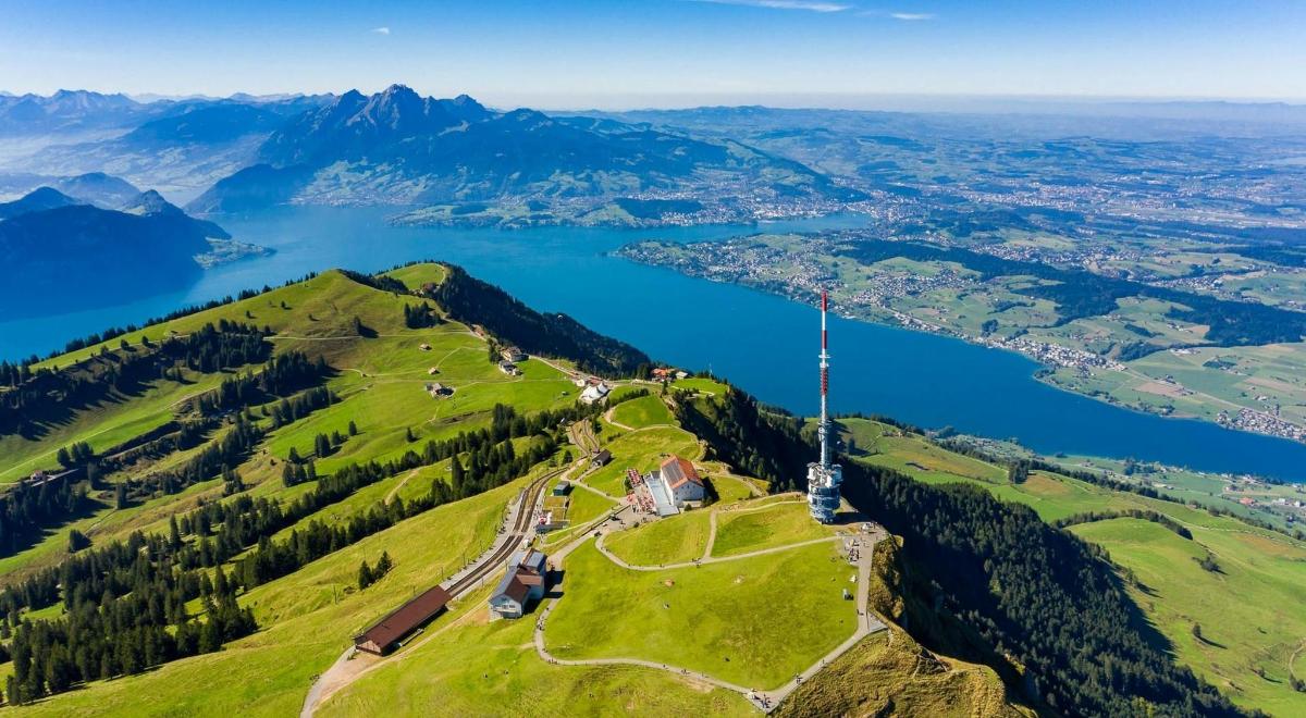 an island on top of a hill with a body of water