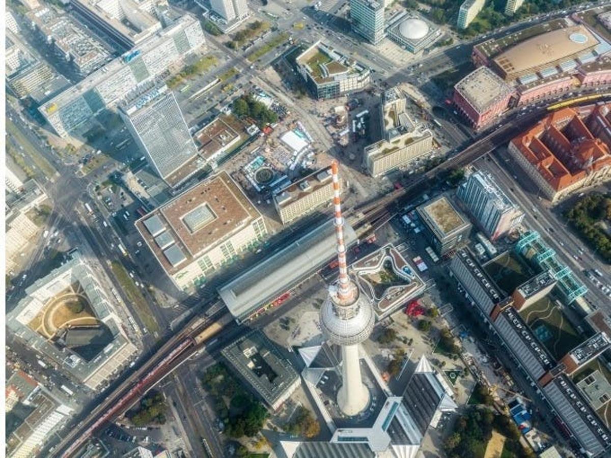 an overhead view of a city with a tower