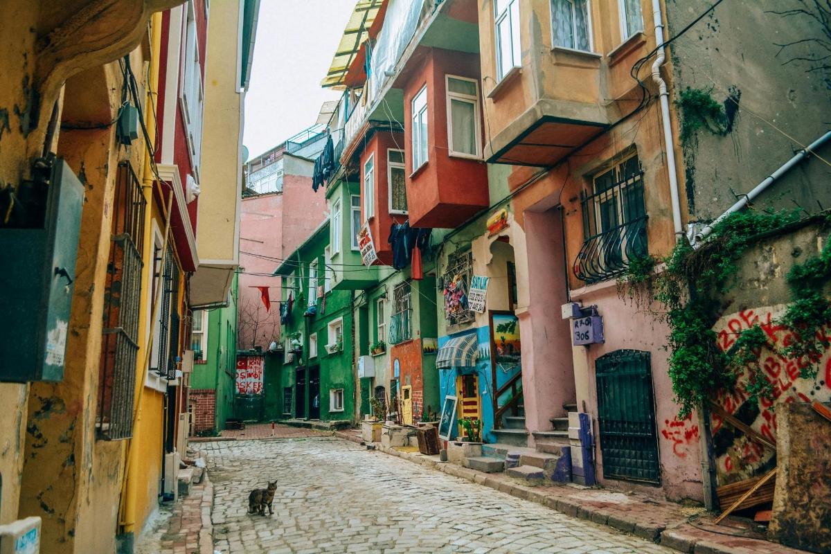 an alley in an old town with colorful buildings