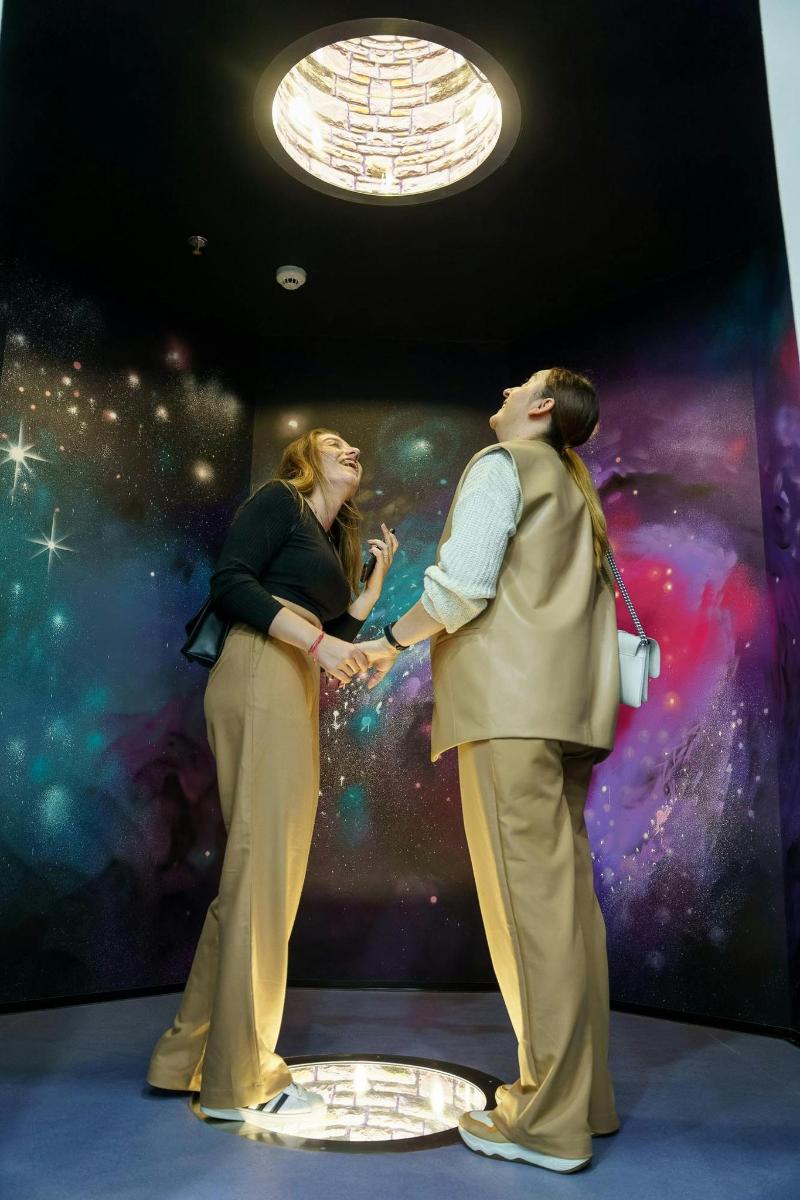 a man and woman standing next to each other on a stage