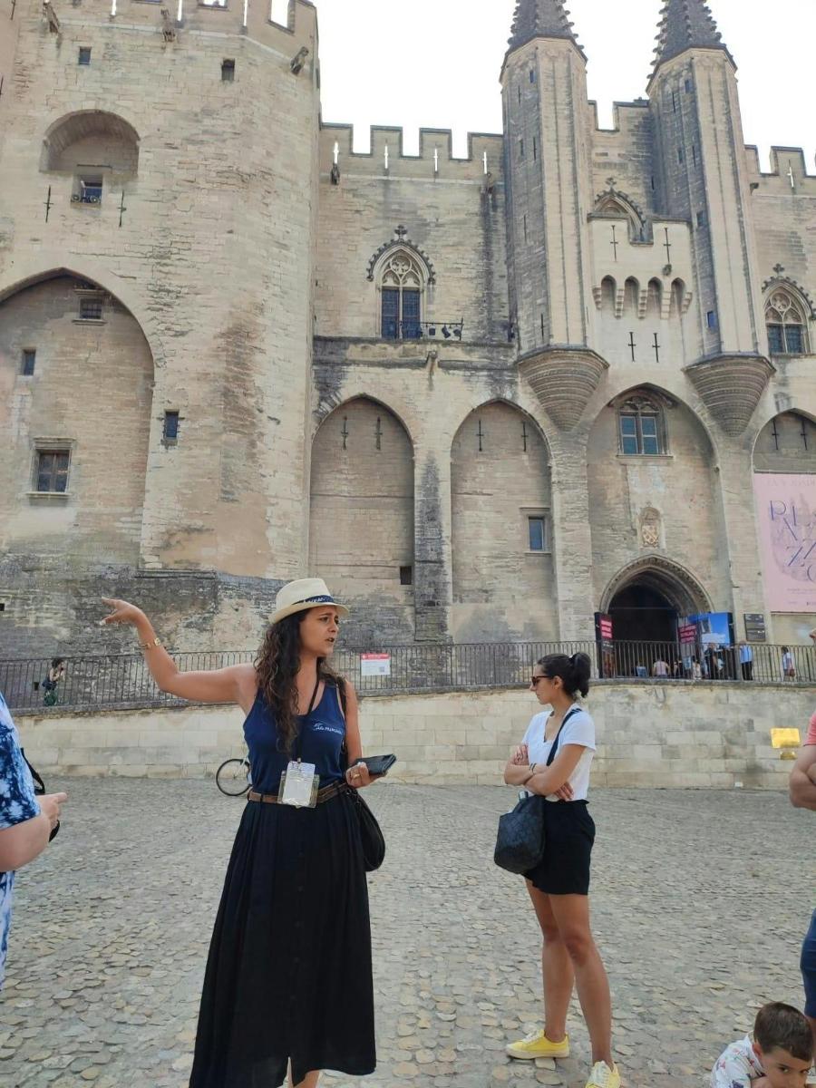 a group of people standing in front of a castle