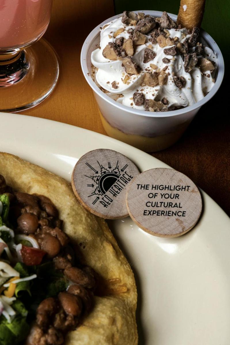 a table with a plate of food and a drink