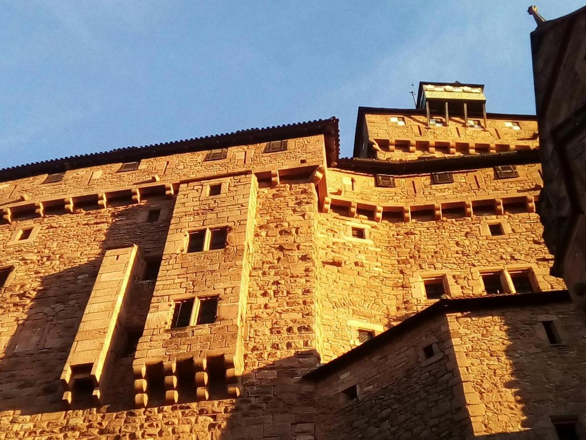 a tall brick building with a tower
