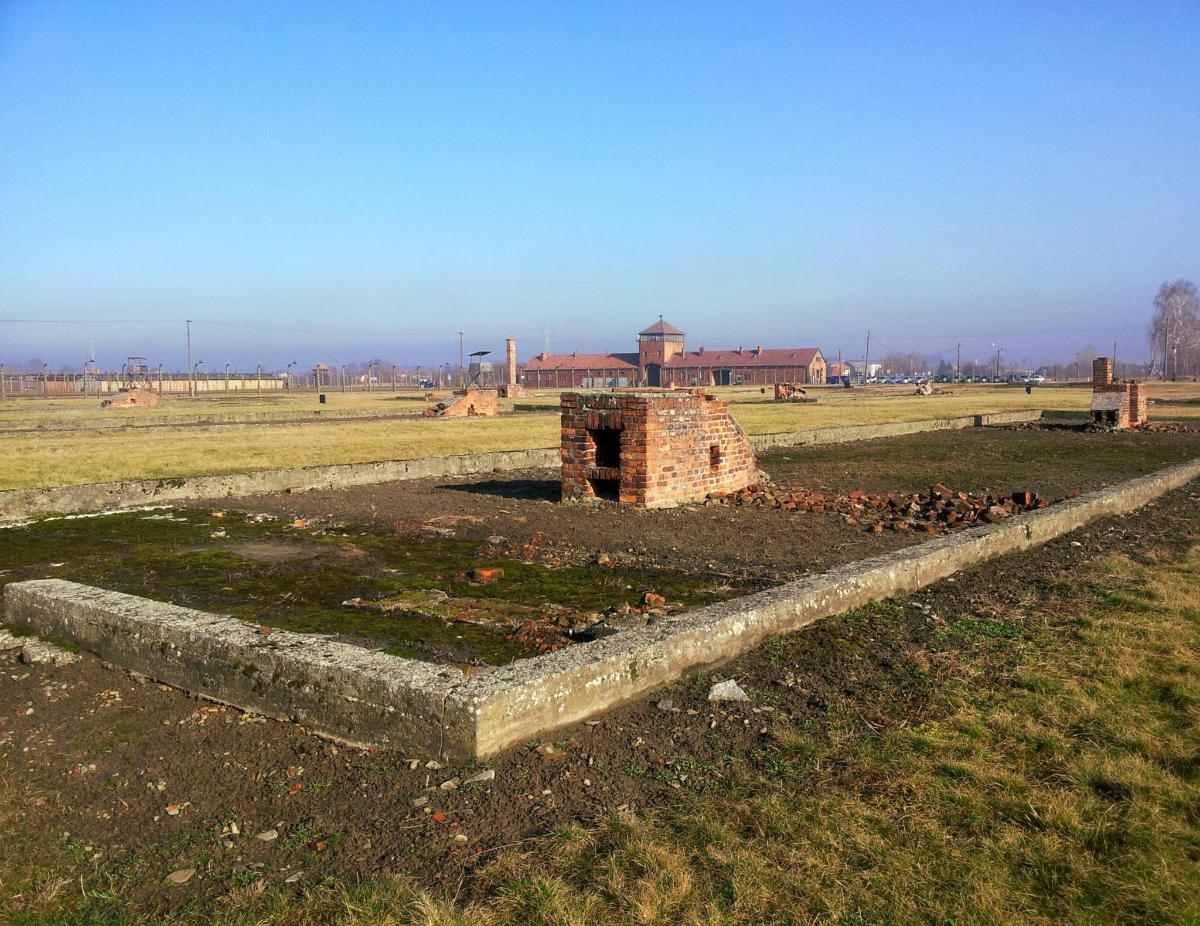 a brick wall in the middle of a field