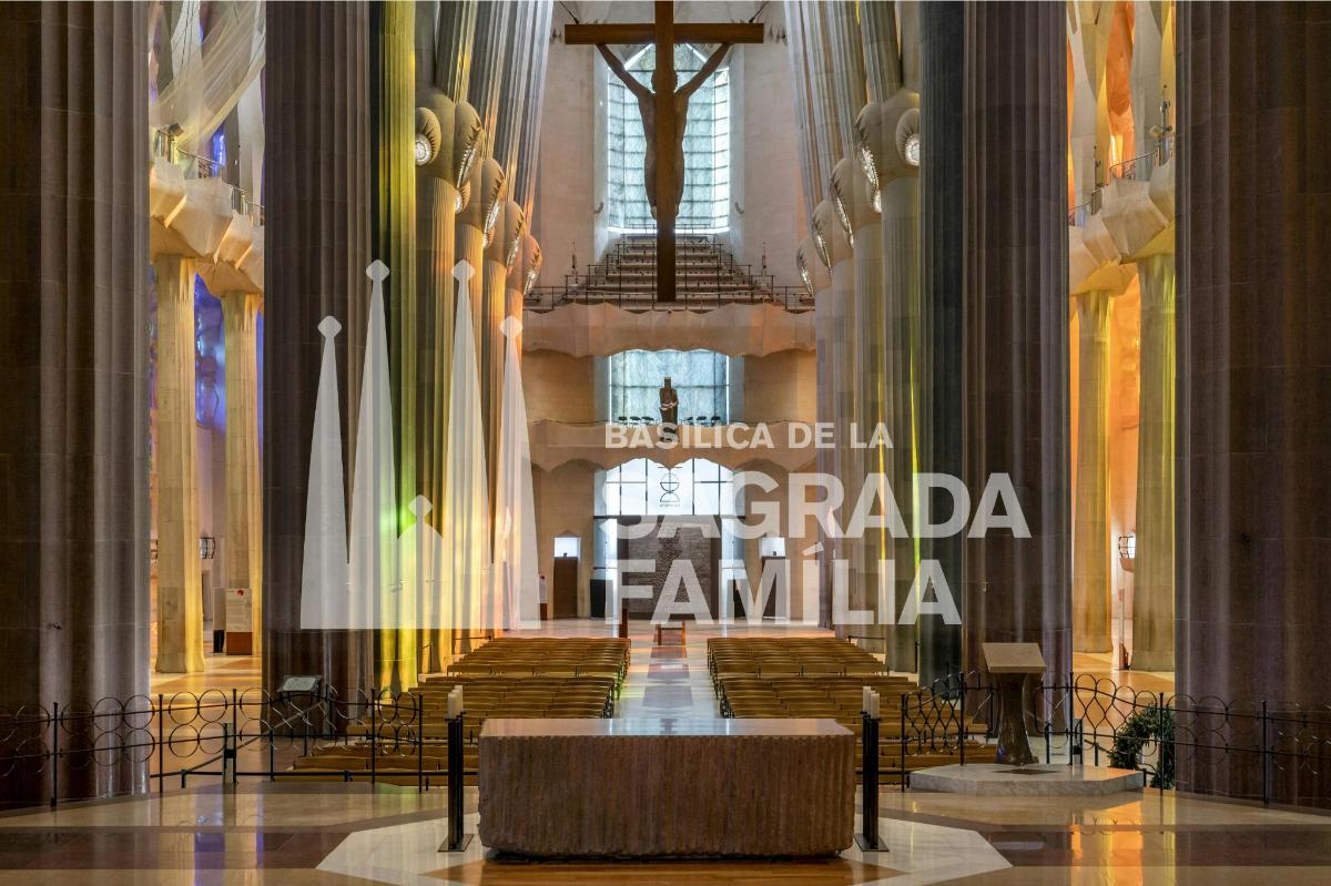 a hall in a cathedral with benches and a poster