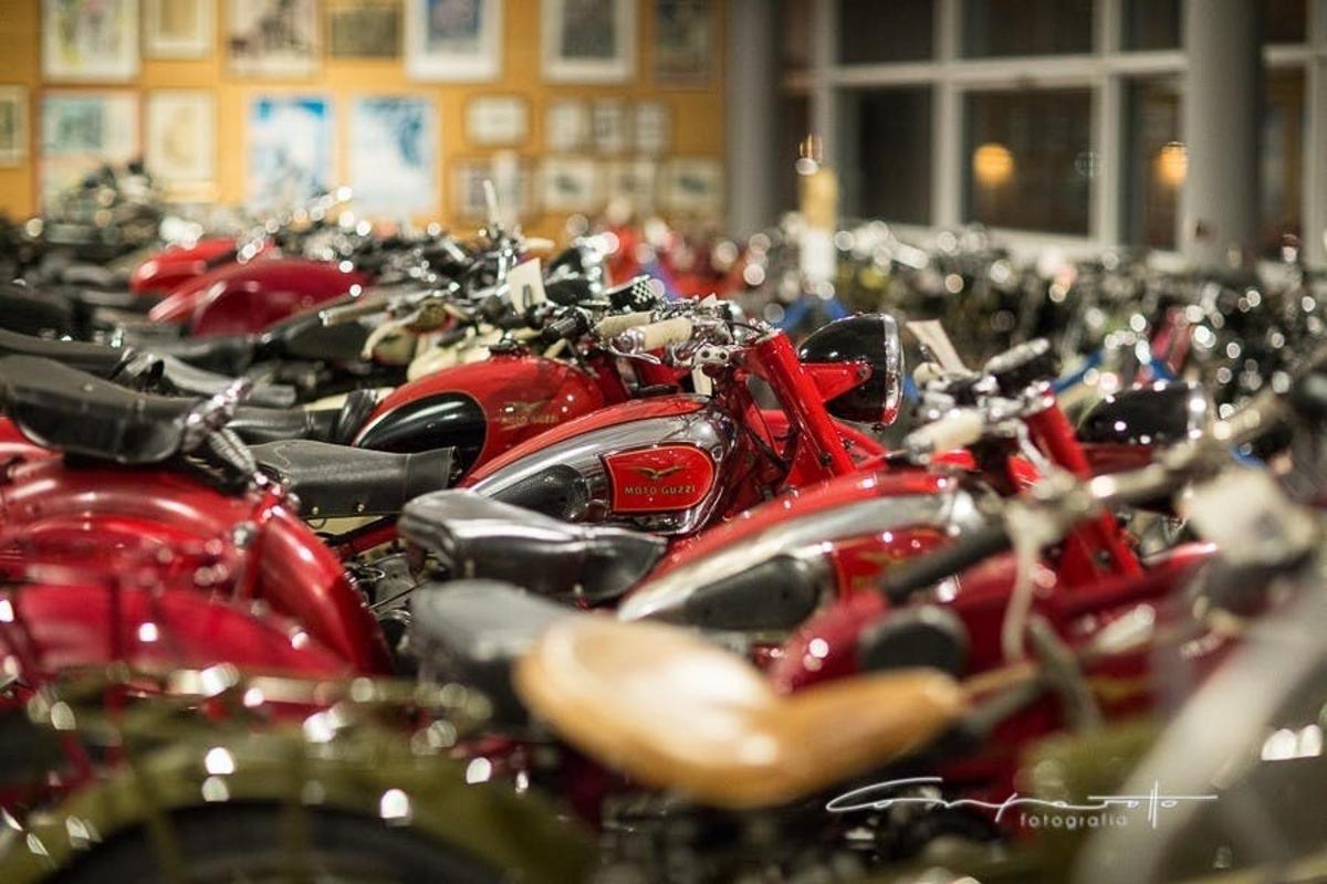 a bunch of motorcycles parked in a row