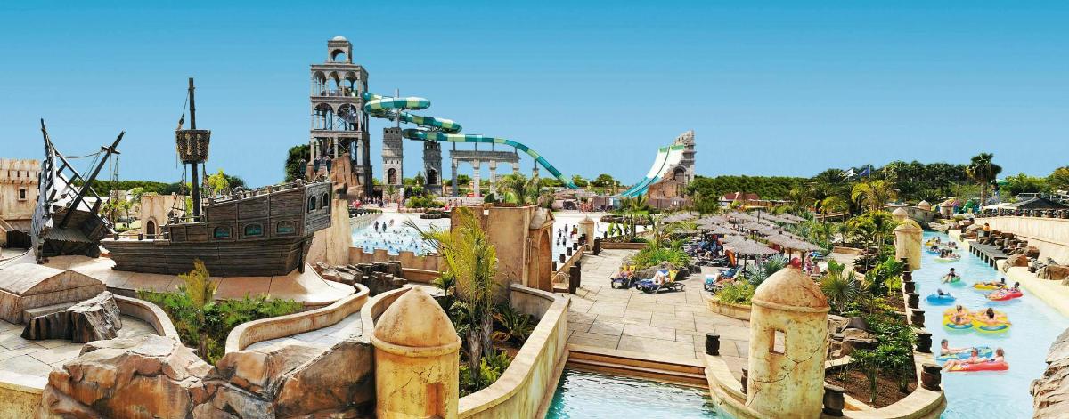 a water park with a pool and a water slide