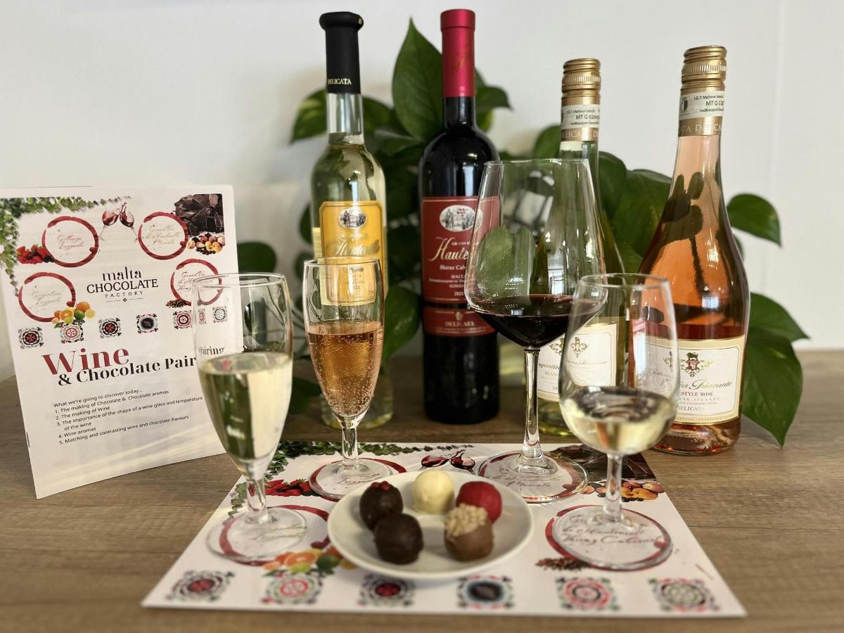 a table with wine glasses and a plate of food