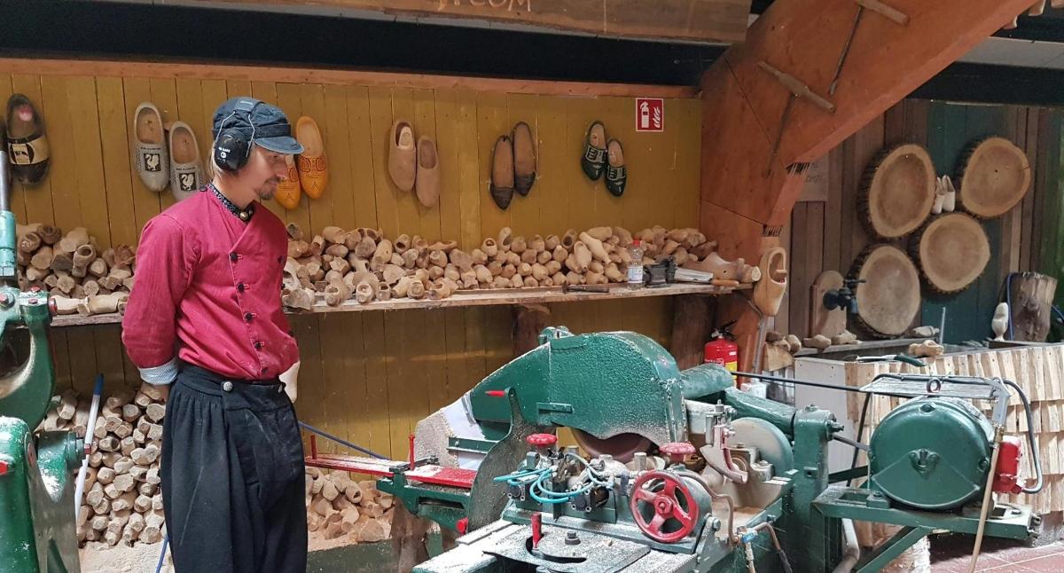 a man standing next to a machine in a store