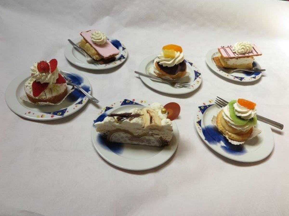 a group of desserts on plates on a table