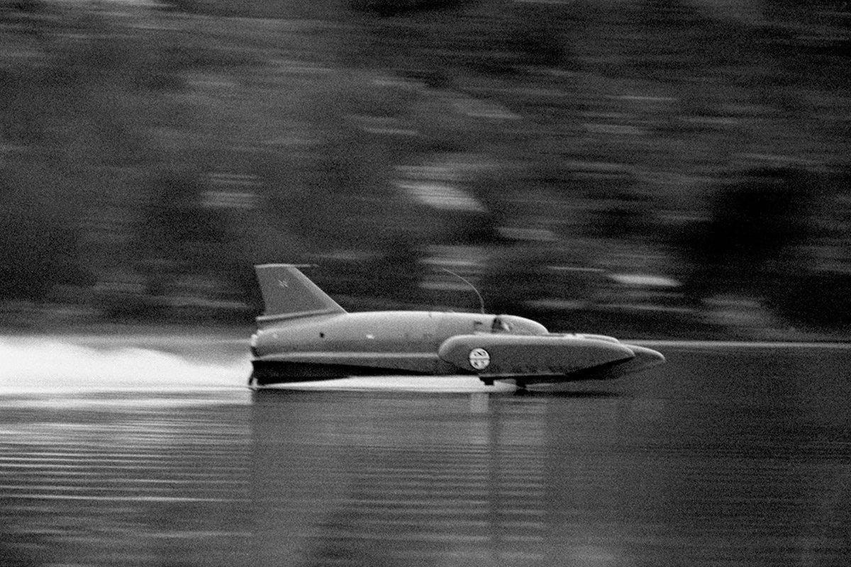 a toy airplane sitting on top of the water