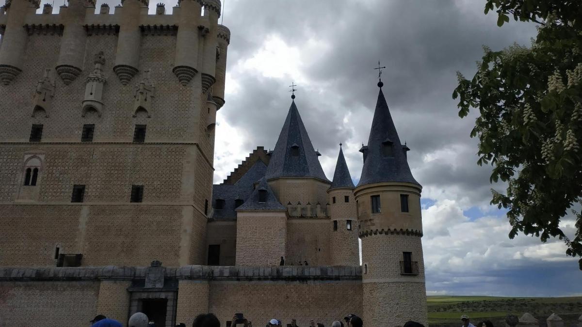 a castle with turrets and towers on top of it