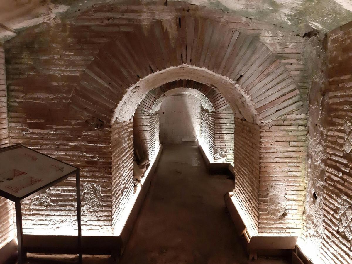 an empty hallway in an old brick building