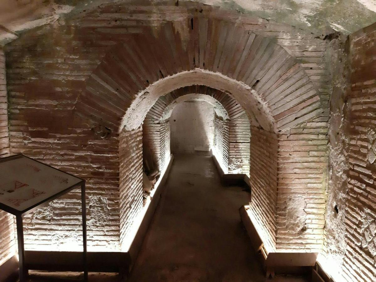 an empty hallway in an old brick building
